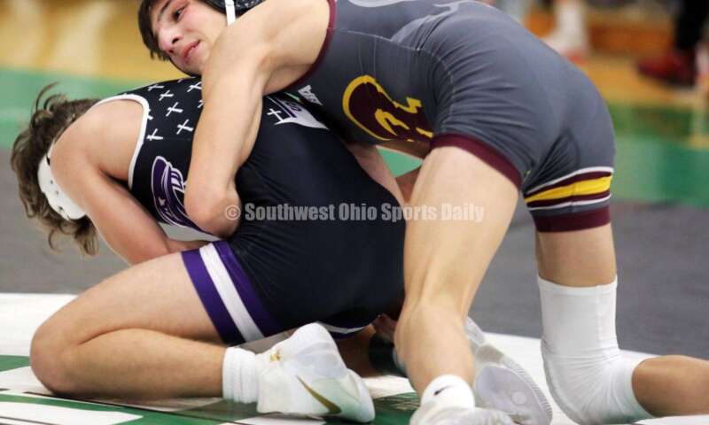 Ross High School's Jovanni Greco is on top of Elder's Joey Thamann in a 113-pound match Dec. 19, 2021, during the Southwest Ohio Wrestling Coaches Association Coaches Classic at Harrison High School. RICK CASSANO/STAFF