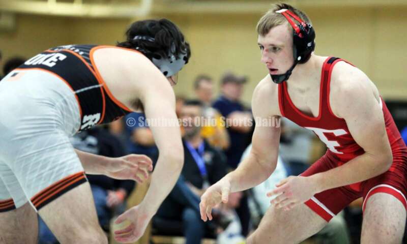 Fairfield High School's Evan Huxsoll (right) squares off with Caleb Duke of Ryle (Ky.) in a 175-pound match Dec. 19, 2021, during the Southwest Ohio Wrestling Coaches Association Coaches Classic at Harrison High School. RICK CASSANO/STAFF