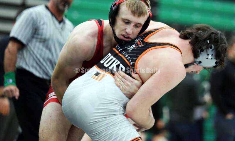 Fairfield High School's Evan Huxsoll grabs Caleb Duke of Ryle (Ky.) in a 175-pound match Dec. 19, 2021, during the Southwest Ohio Wrestling Coaches Association Coaches Classic at Harrison High School. RICK CASSANO/STAFF