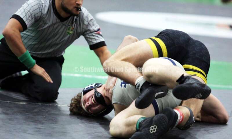 Edgewood High School's Aiden Rader (left) battles Centerville's Aydan George in a 165-pound match Dec. 19, 2021, during the Southwest Ohio Wrestling Coaches Association Coaches Classic at Harrison High School. RICK CASSANO/STAFF