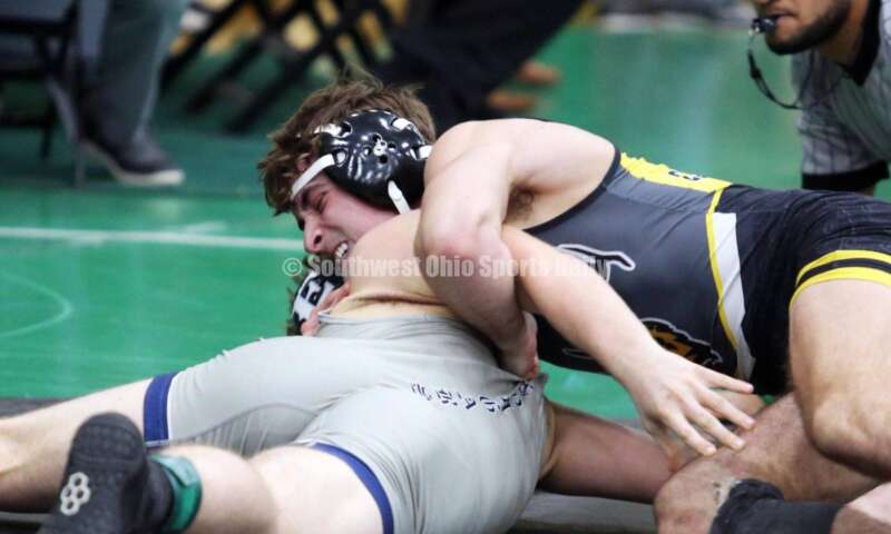 Centerville High School's Aydan George has a grip on Edgewood's Aiden Rader in a 165-pound match Dec. 19, 2021, during the Southwest Ohio Wrestling Coaches Association Coaches Classic at Harrison High School. RICK CASSANO/STAFF