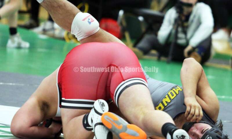 Monroe High School's Chris Reber (right) battles Huber Heights Wayne's Joshua Padilla in the 285-pound championship match Dec. 19, 2021, during the Southwest Ohio Wrestling Coaches Association Coaches Classic at Harrison High School. RICK CASSANO/STAFF