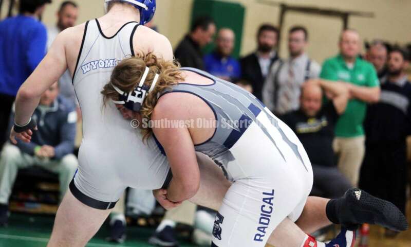 Edgewood High School's Radical Rothermel (right) battles Wyoming's Bruce Wagers in a 285-pound match Dec. 19, 2021, during the Southwest Ohio Wrestling Coaches Association Coaches Classic at Harrison High School. RICK CASSANO/STAFF