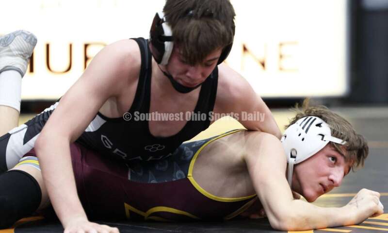 Ross High School's Jovanni Greco (bottom) competes with St. Paris Graham's Brogan Tucker during the 113-pound championship match at the Division II district wrestling tournament March 5, 2022, in Wilmington. RON ALVEY/CONTRIBUTOR
