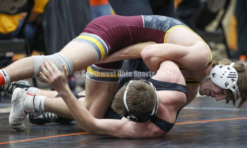 Ross High School's Ryan Foster is in control of Wilmington's Carson Hibbs during the 132-pound third-place match at the Division II district wrestling tournament March 5, 2022, in Wilmington. RON ALVEY/CONTRIBUTOR