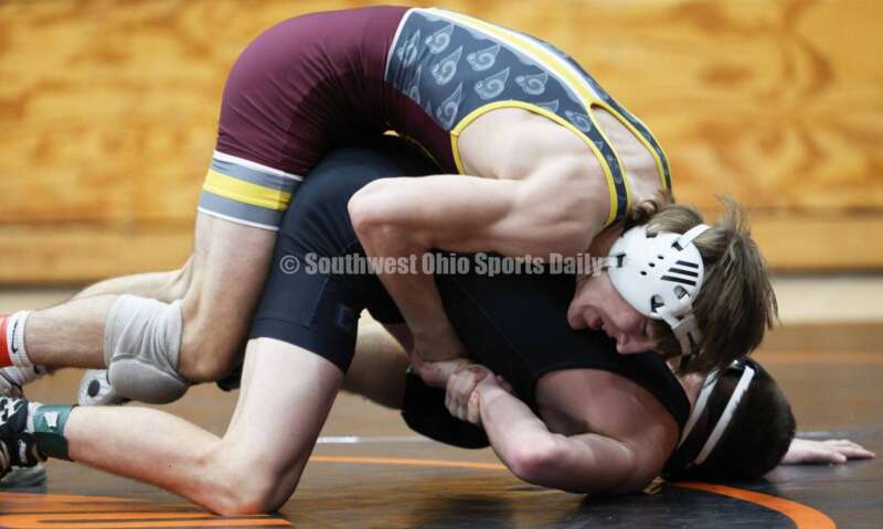 Ross High School's Ryan Foster is on top of Wilmington's Carson Hibbs during the 132-pound third-place match at the Division II district wrestling tournament March 5, 2022, in Wilmington. RON ALVEY/CONTRIBUTOR