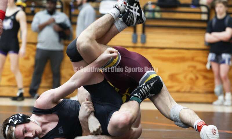 Ross High School's Ryan Foster is on top of Wilmington's Carson Hibbs during the 132-pound third-place match at the Division II district wrestling tournament March 5, 2022, in Wilmington. RON ALVEY/CONTRIBUTOR