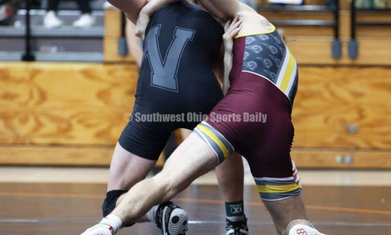 Ross High School's Ryan Foster (right) competes with Wilmington's Carson Hibbs during the 132-pound third-place match at the Division II district wrestling tournament March 5, 2022, in Wilmington. RON ALVEY/CONTRIBUTOR