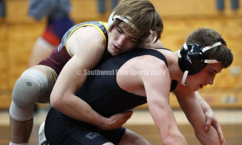 Ross High School's Ryan Foster is on top of Wilmington's Carson Hibbs during the 132-pound third-place match at the Division II district wrestling tournament March 5, 2022, in Wilmington. RON ALVEY/CONTRIBUTOR