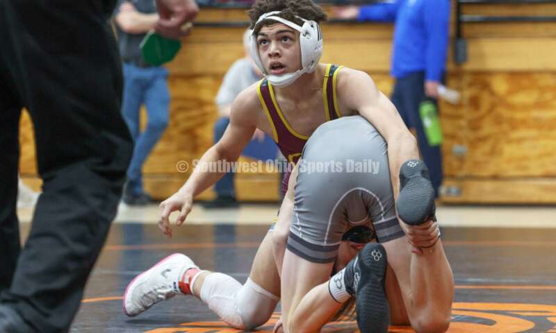 Ross High School's Jordan Miller is on top of Granville's Peyton Costa during the 106-pound third-place match at the Division II district wrestling tournament March 5, 2022, in Wilmington. RON ALVEY/CONTRIBUTOR