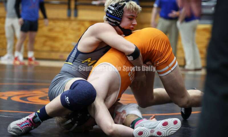 Monroe High School's Alex Pitsch (left) handles Heath's Riley Gould during the 150-pound third-place match at the Division II district wrestling tournament March 5, 2022, in Wilmington. RON ALVEY/CONTRIBUTOR