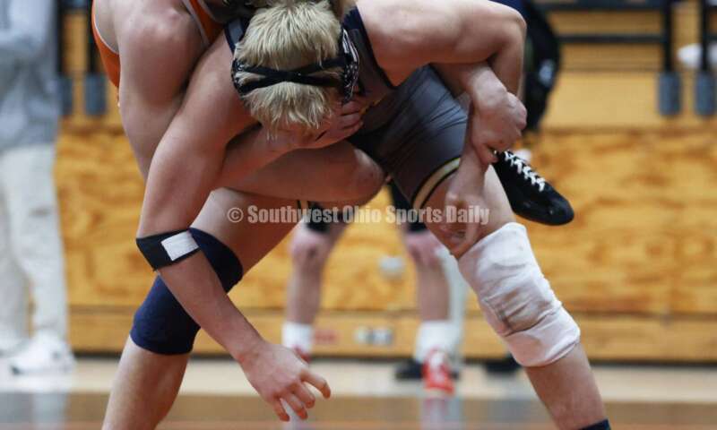 Monroe High School's Alex Pitsch has Heath's Riley Gould on his back during the 150-pound third-place match at the Division II district wrestling tournament March 5, 2022, in Wilmington. RON ALVEY/CONTRIBUTOR