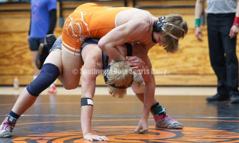 Monroe High School's Alex Pitsch has Heath's Riley Gould on his back during the 150-pound third-place match at the Division II district wrestling tournament March 5, 2022, in Wilmington. RON ALVEY/CONTRIBUTOR