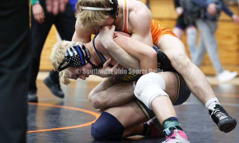 Monroe High School's Alex Pitsch has Heath's Riley Gould on his back during the 150-pound third-place match at the Division II district wrestling tournament March 5, 2022, in Wilmington. RON ALVEY/CONTRIBUTOR