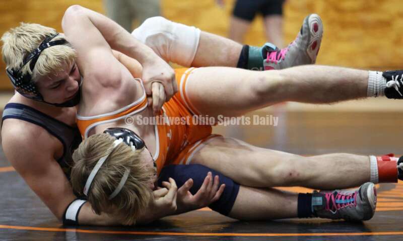 Monroe High School's Alex Pitsch (left) handles Heath's Riley Gould in the 150-pound third-place match at the Division II district wrestling tournament March 5, 2022, in Wilmington. RON ALVEY/CONTRIBUTOR