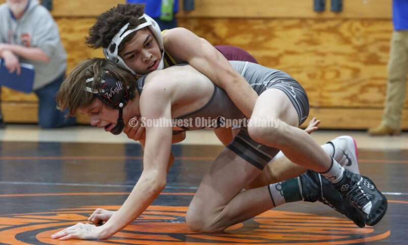 Ross High School's Jordan Miller (top) battles Granville's Peyton Costa during the 106-pound third-place match at the Division II district wrestling tournament March 5, 2022, in Wilmington. RON ALVEY/CONTRIBUTOR