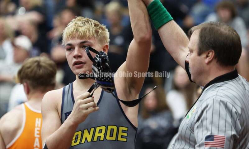 Monroe High School's Alex Pitsch reacts after beating Heath's Riley Gould in the 150-pound third-place match at the Division II district wrestling tournament March 5, 2022, in Wilmington. RON ALVEY/CONTRIBUTOR