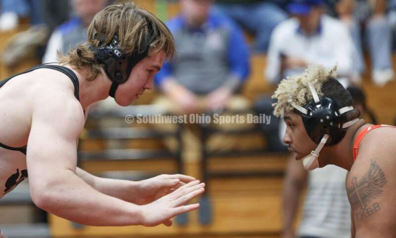 Badin High School's Ely Emmons (left) squares off with London's Antonio Burns in the 215-pound third-place match at the Division II district wrestling tournament March 5, 2022, in Wilmington. RON ALVEY/CONTRIBUTOR