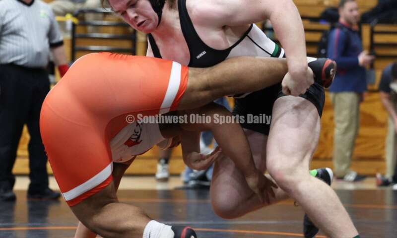 Badin High School's Ely Emmons (right) grabs London's Antonio Burns in the 215-pound third-place match at the Division II district wrestling tournament March 5, 2022, in Wilmington. RON ALVEY/CONTRIBUTOR