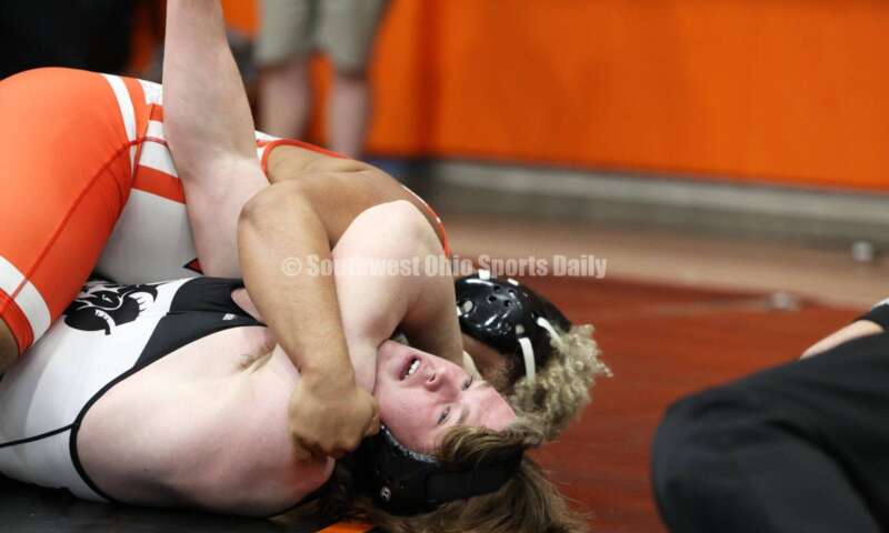 Badin High School's Ely Emmons (bottom) competes with London's Antonio Burns in the 215-pound third-place match at the Division II district wrestling tournament March 5, 2022, in Wilmington. RON ALVEY/CONTRIBUTOR