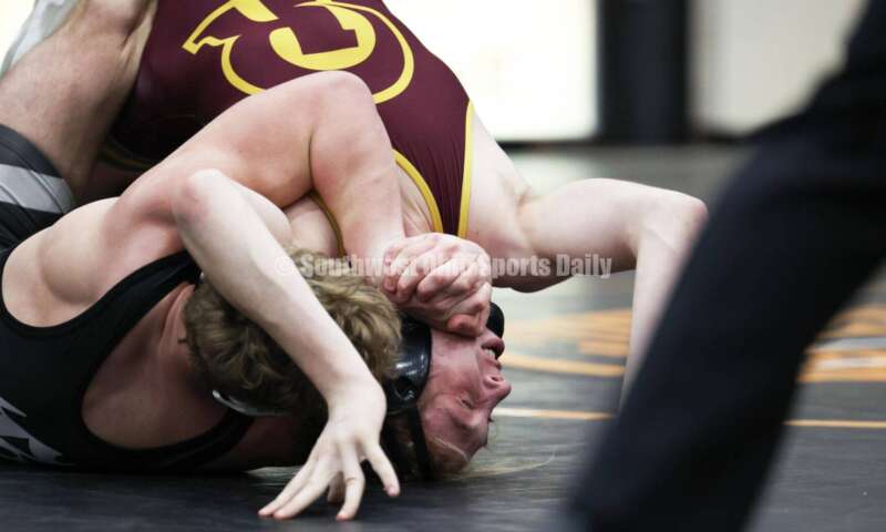Ross High School's Ryan Iams (right) competes with St. Paris Graham's Zack Burroughs in the 175-pound championship match at the Division II district wrestling tournament March 5, 2022, in Wilmington. RON ALVEY/CONTRIBUTOR