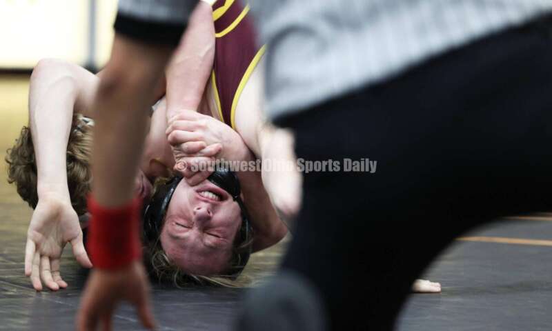 Ross High School's Ryan Iams (facing camera) battles St. Paris Graham's Zack Burroughs in the 175-pound championship match at the Division II district wrestling tournament March 5, 2022, in Wilmington. RON ALVEY/CONTRIBUTOR