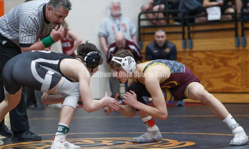 Ross High School's Jovanni Greco (right) squares off with St. Paris Graham's Brogan Tucker during the 113-pound championship match at the Division II district wrestling tournament March 5, 2022, in Wilmington. RON ALVEY/CONTRIBUTOR