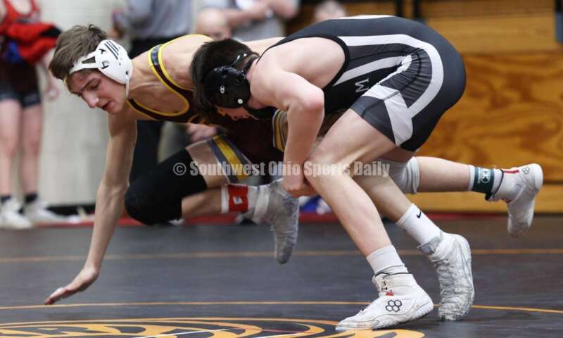Ross High School's Jovanni Greco (left) competes with St. Paris Graham's Brogan Tucker during the 113-pound championship match at the Division II district wrestling tournament March 5, 2022, in Wilmington. RON ALVEY/CONTRIBUTOR