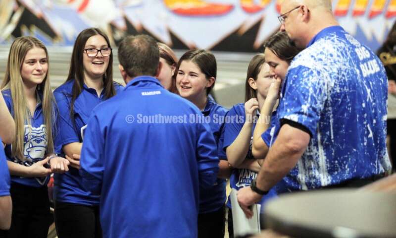 Hamilton High School coach Nick Arvin (middle) talks to his team between games March 12, 2022, during the Division I state girls bowling tournament at Wayne Webb's Columbus Bowl. RICK CASSANO/STAFF