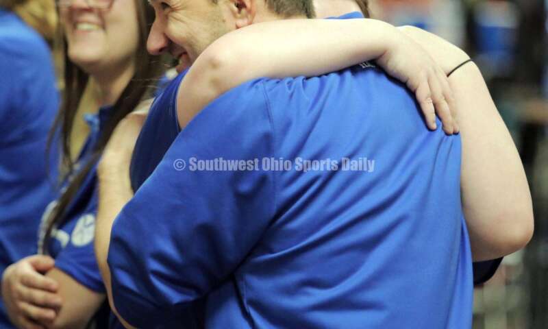 Hamilton High School coach Nick Arvin hugs Madison Harnish on March 12, 2022, during the Division I state girls bowling tournament at Wayne Webb's Columbus Bowl. RICK CASSANO/STAFF