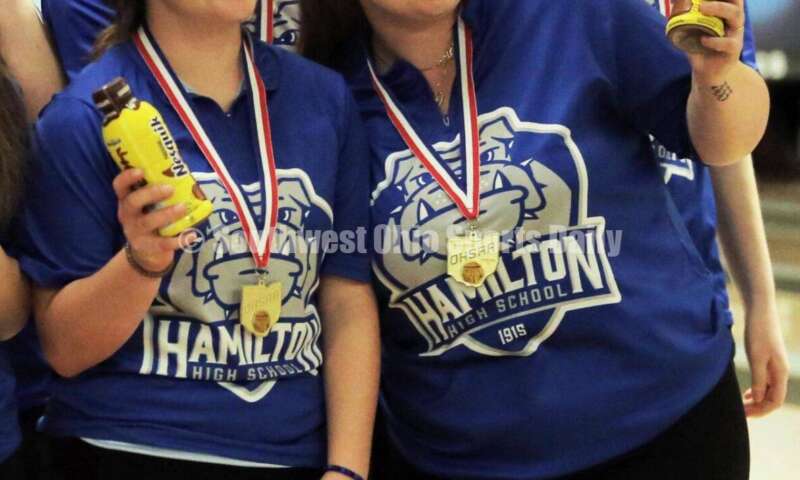 Hamilton High School's (clockwise from left) Shelbie Deaton, Lilly Arvin, Allison Porter and Gabby Bryan celebrate with some chocolate milk March 12, 2022, at the Division I state girls bowling tournament at Wayne Webb's Columbus Bowl. RICK CASSANO/STAFF
