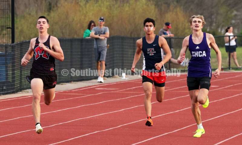 Madison High School's Alden Graham (left), Talawanda's Jonah Femiani (middle) and Cincinnati Hills Christian Academy's Austin Gibson run in the boys 400-meter race April 16, 2024, during the Dale Plank Invitational track & field meet at Talawanda. RICK CASSANO/STAFF