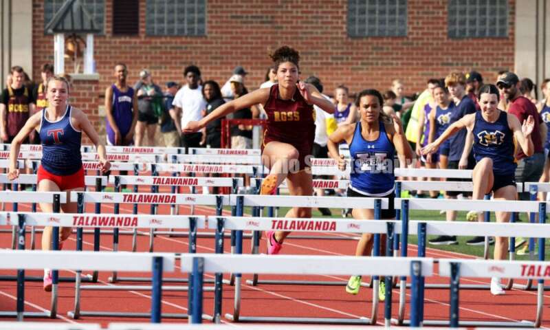 Ross High School's Myah Boze leads (from left) Talawanda's Gracie Bower, Hamilton's Makayla Platt and Monroe's Emma Faccinto in the girls 100-meter hurdles April 16, 2024, during the Dale Plank Invitational track & field meet at Talawanda. RICK CASSANO/STAFF