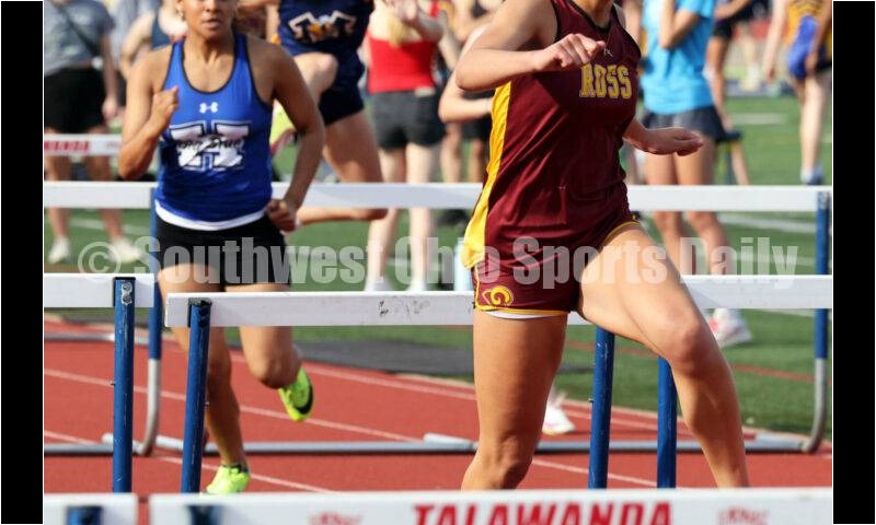 Ross High School's Myah Boze is en route to victory in the girls 100-meter hurdles April 16, 2024, during the Dale Plank Invitational track & field meet at Talawanda. RICK CASSANO/STAFF