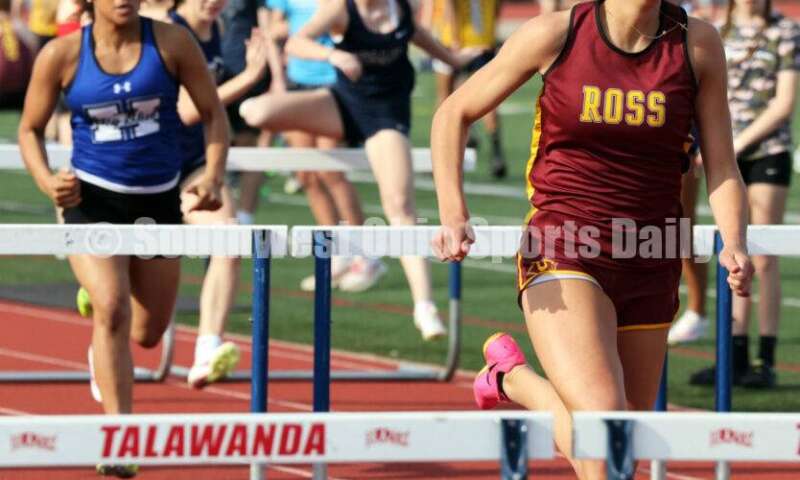 Ross High School's Myah Boze leads the way in the girls 100-meter hurdles April 16, 2024, during the Dale Plank Invitational track & field meet at Talawanda. RICK CASSANO/STAFF
