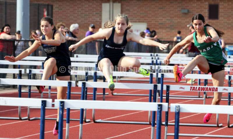 Edgewood High School's Noelle Lockerby (middle) runs against Badin's Allison Falk (right) and Valley View's Claire Barnett in the 100-meter hurdles April 16, 2024, during the Dale Plank Invitational track & field meet at Talawanda. RICK CASSANO/STAFF