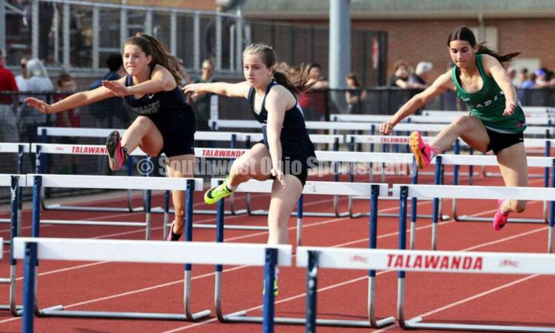 Edgewood High School's Noelle Lockerby (middle) runs against Badin's Allison Falk (right) and Valley View's Claire Barnett in the girls 100-meter hurdles April 16, 2024, during the Dale Plank Invitational track & field meet at Talawanda. RICK CASSANO/STAFF