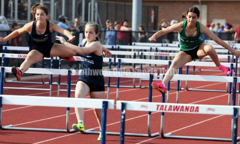 Edgewood High School's Noelle Lockerby (middle) runs against Badin's Allison Falk (right) and Valley View's Claire Barnett in the girls 100-meter hurdles April 16, 2024, during the Dale Plank Invitational track & field meet at Talawanda. RICK CASSANO/STAFF