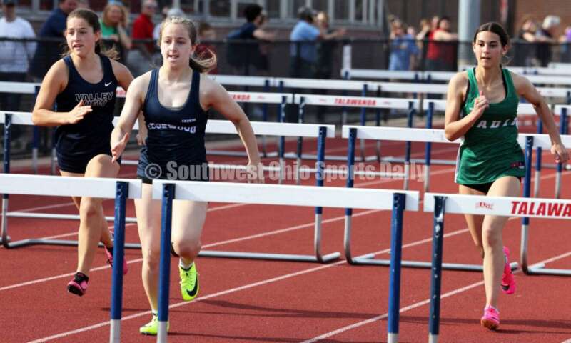 Edgewood High School's Noelle Lockerby (middle) leads Badin's Allison Falk (right) and Valley View's Claire Barnett in the girls 100-meter hurdles April 16, 2024, during the Dale Plank Invitational track & field meet at Talawanda. RICK CASSANO/STAFF