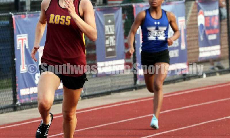 Ross High School's Caroline Chernock moves forward in the girls 400-meter race April 16, 2024, during the Dale Plank Invitational track & field meet at Talawanda. RICK CASSANO/STAFF
