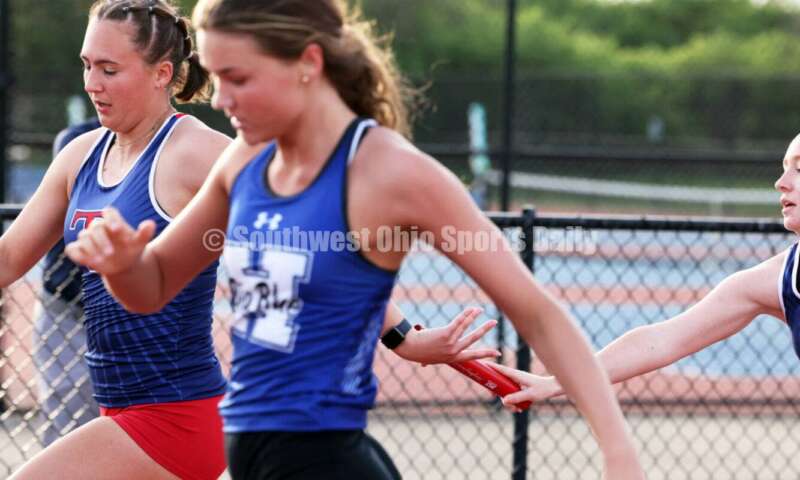 Talawanda High School's Olivia Andrews gets the baton from teammate Tessa Reynolds in the girls 400-meter relay April 16, 2024, during the Dale Plank Invitational track & field meet at Talawanda. RICK CASSANO/STAFF
