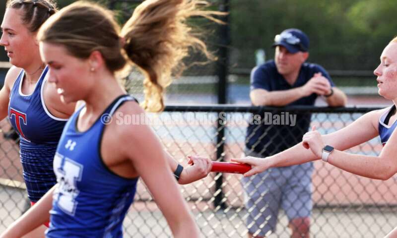 Talawanda High School's Olivia Andrews gets the baton from teammate Tessa Reynolds in the girls 400-meter relay April 16, 2024, during the Dale Plank Invitational track & field meet at Talawanda. RICK CASSANO/STAFF