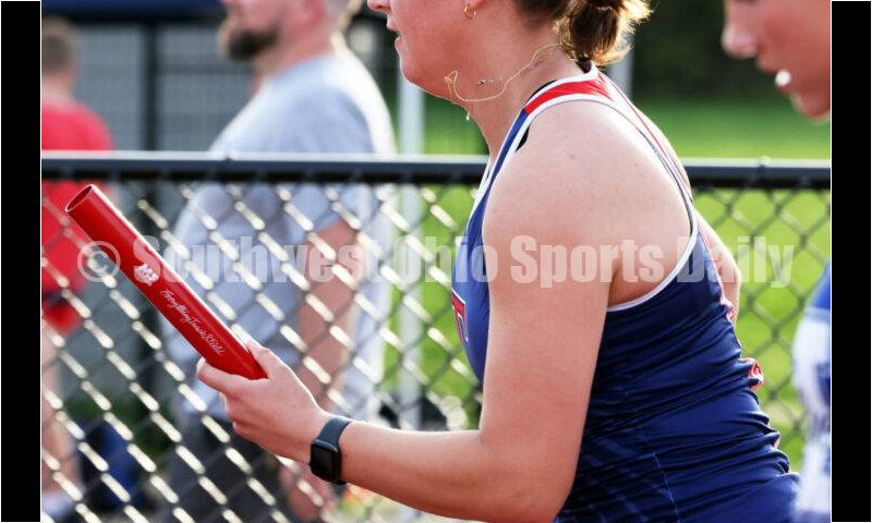 Talawanda High School's Olivia Andrews takes off with the baton in the final leg of the girls 400-meter relay April 16, 2024, during the Dale Plank Invitational track & field meet at Talawanda. RICK CASSANO/STAFF