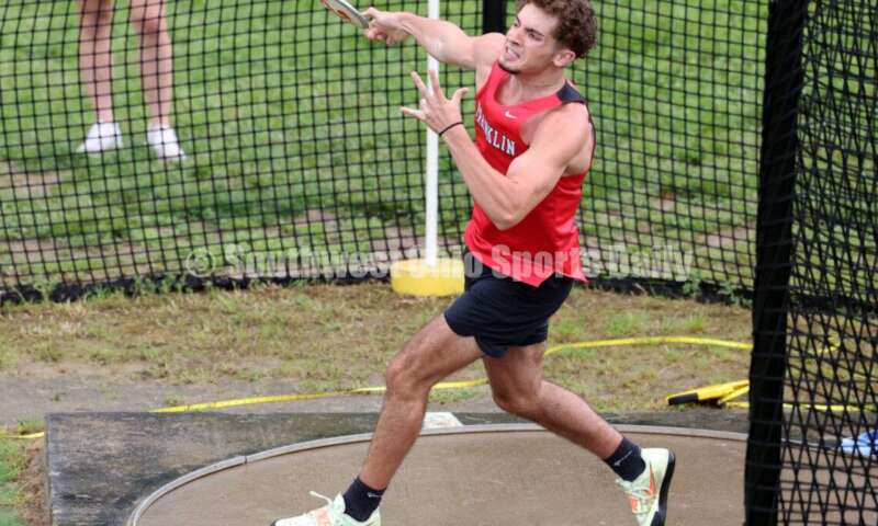 Franklin High School's Trey Newsome unleashes a throw in the boys discus May 15 2024, during the Division I district track & field meet at Bellbrook. RICK CASSANO/STAFF