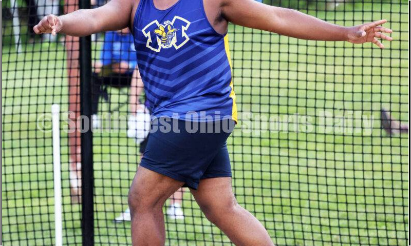 Monroe High School's Myles Terry watches a throw in the boys discus May 15 2024, during the Division I district track & field meet at Bellbrook. RICK CASSANO/STAFF