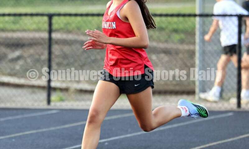 Franklin High School's Maelynn Perkins runs in the girls 400-meter preliminary race May 15 2024, during the Division I district track & field meet at Bellbrook. RICK CASSANO/STAFF