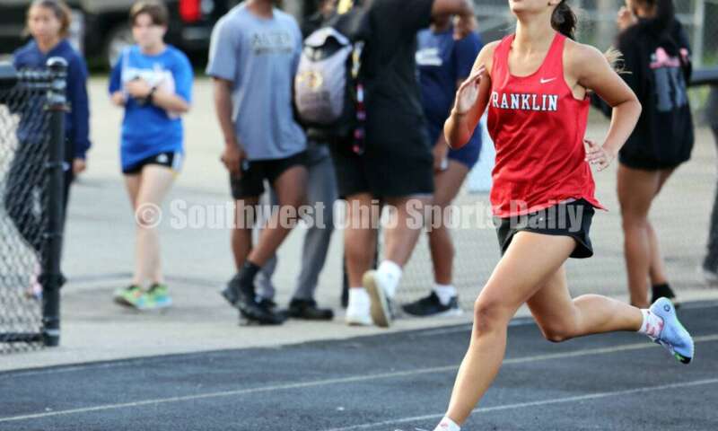 Franklin High School's Maelynn Perkins runs in the girls 400-meter preliminary race May 15 2024, during the Division I district track & field meet at Bellbrook. RICK CASSANO/STAFF