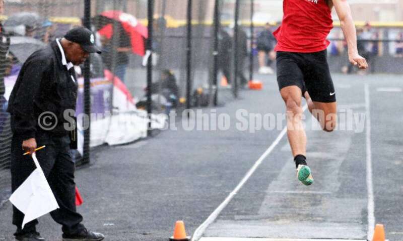 Franklin High School's Josh Carter flies through the air in the boys long jump May 15 2024, during the Division I district track & field meet at Bellbrook. RICK CASSANO/STAFF