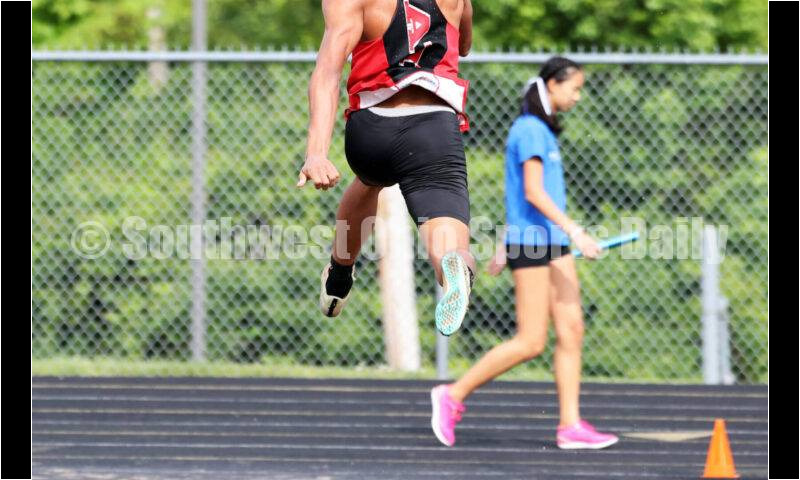 Franklin High School's Josh Carter flies through the air in the boys long jump May 15 2024, during the Division I district track & field meet at Bellbrook. RICK CASSANO/STAFF