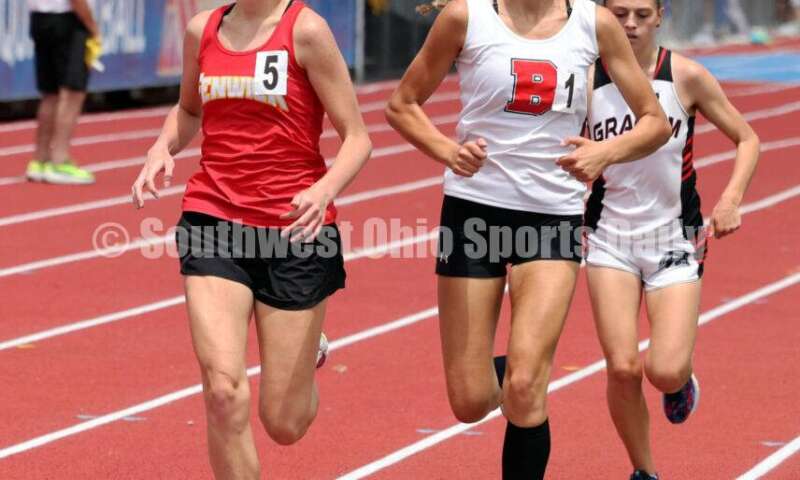 Fenwick High School's Morgan Blair (left) runs next to Bellefontaine's Grace Brown in the girls 1,600-meter race May 25, 2024, during the Division II regional track & field meet at Piqua. RICK CASSANO/STAFF